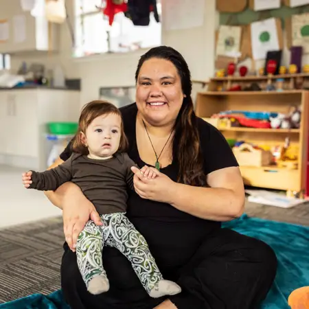 Image of women holding a child