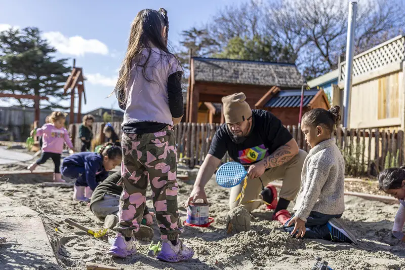 Image of children playing in a sandpit