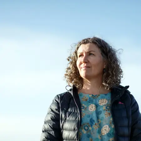 Image of a women with blue sky background